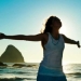 Lady on beach outstretched