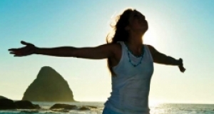 Lady on beach outstretched